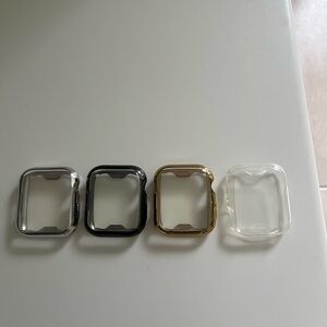 Set of 4 Watch Cases in Silver, Black, Gold, and Clear